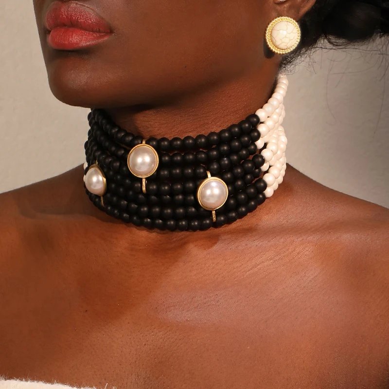 Parure Vintage Perles Choker & Boucles d’Oreilles – Collier Ras-du-Cou Élégant Géométrique Femme | Bijoux Mariage & Soirée Chic 1 Sublimez votre style avec cette parure vintage perles choker et boucles assorties. Élégance rétro, effet glamour immédiat. Idéal mariage, soirée, événement chic. Livraison rapide.